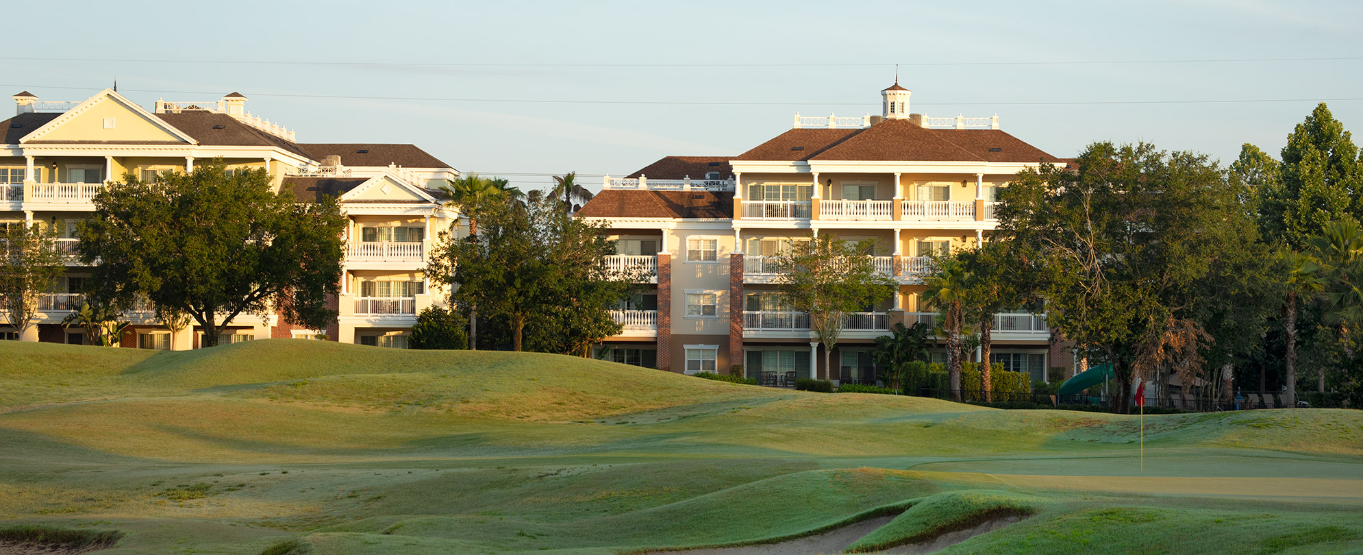 The outside of WorldMark Reunion and Club Wyndham Reunion resort from the golf course.