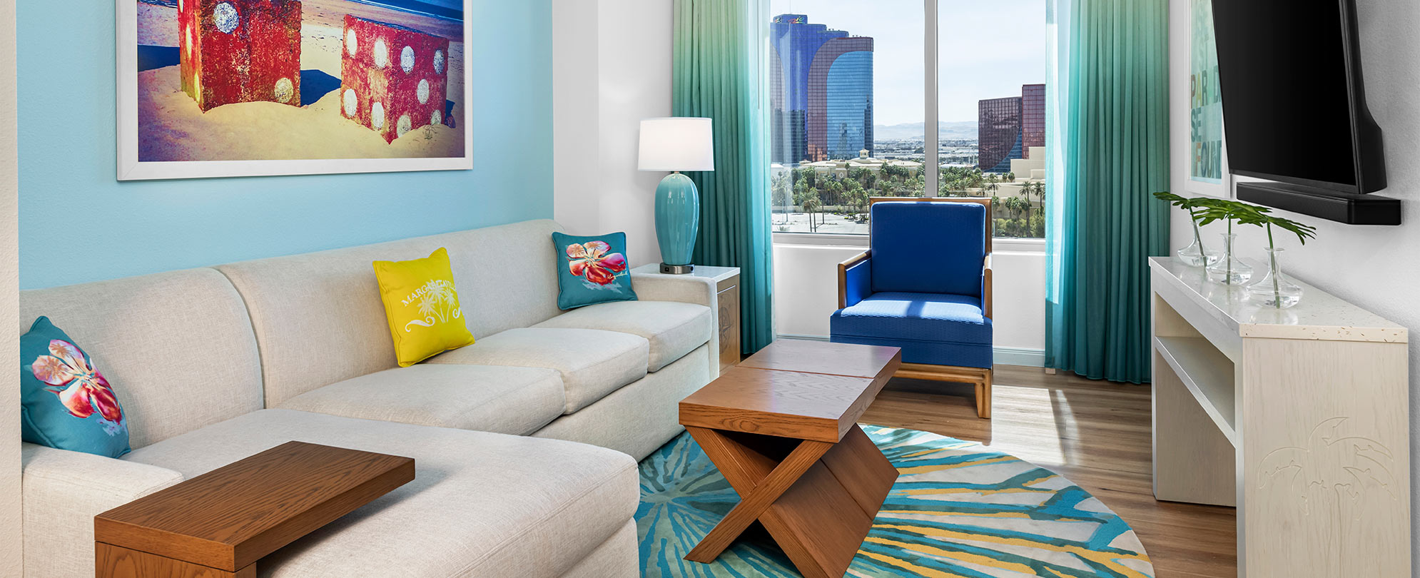 Chic living room with colorful pillows at Margaritaville Vacation Club by Wyndham - Desert Blue in Las Vegas, NV.