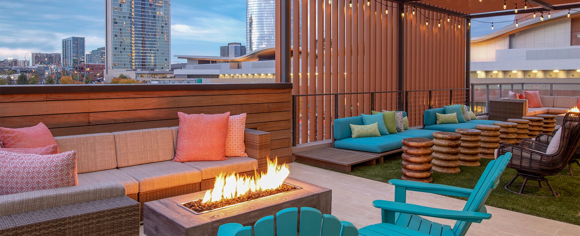 A city view at night from the rooftop lounge and firepit area at the Margaritaville Vacation Club in Nashville, TN. 